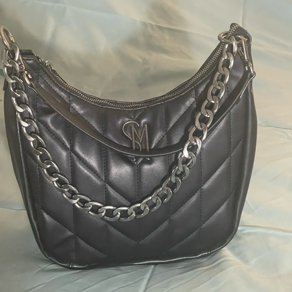 Steve Madden Black Quilted Shoulder Bag with Silver Chain and silver tone logo.